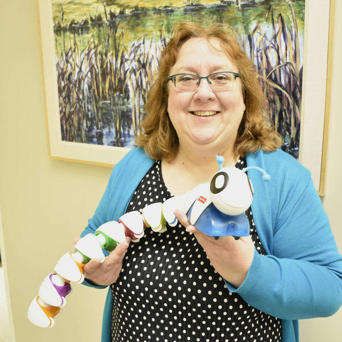 Woman holding plastic toy