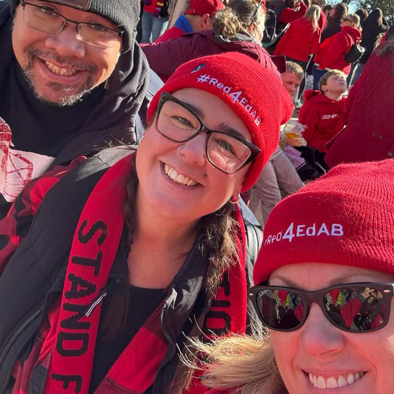 Three teachers at a rally